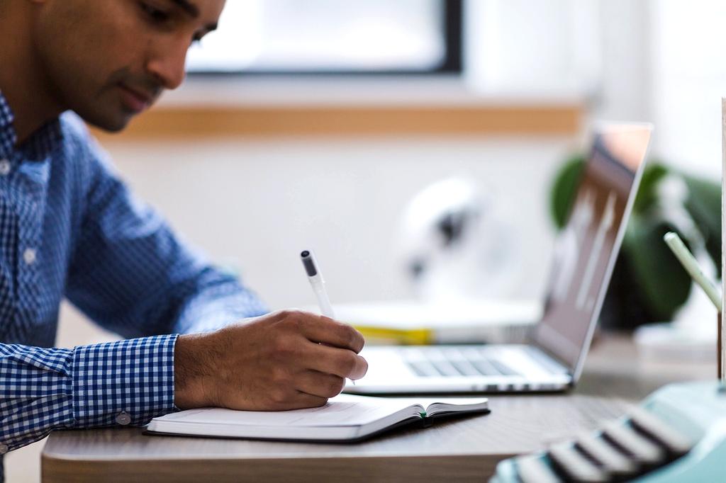 Person reading help guide on laptop
