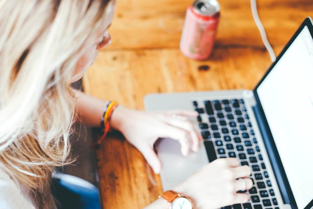 Modern writing workspace with laptop and coffee